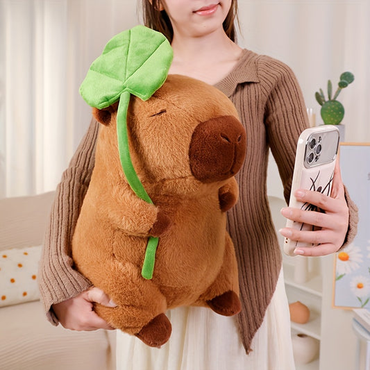 Plush capybara with a lotus leaf hat
